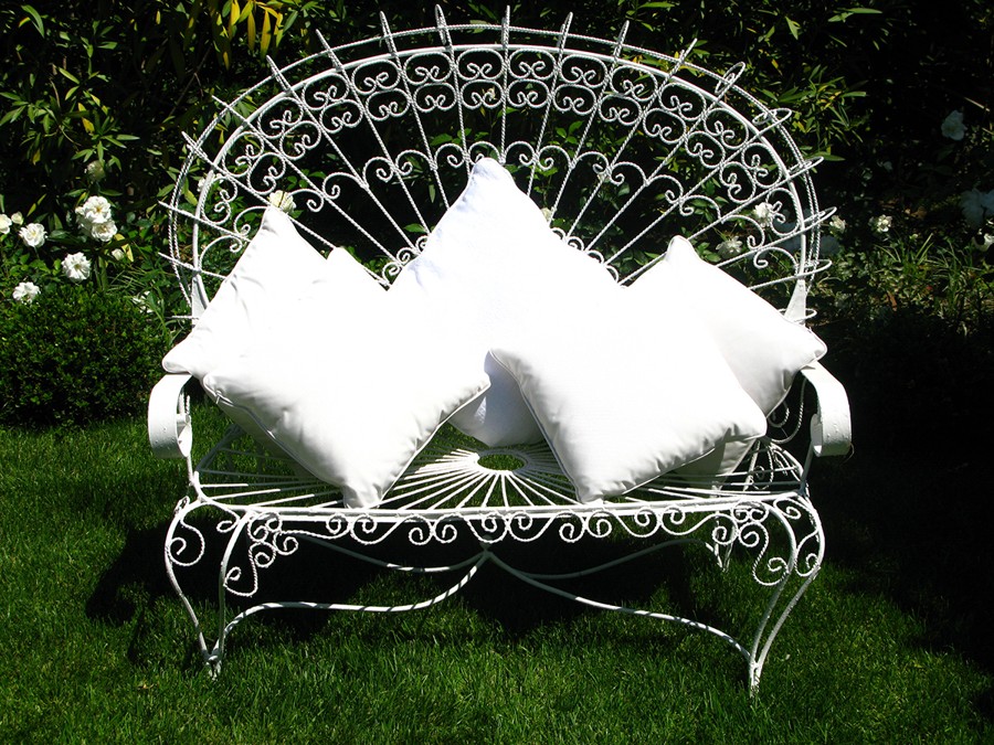 The wrought-iron seat